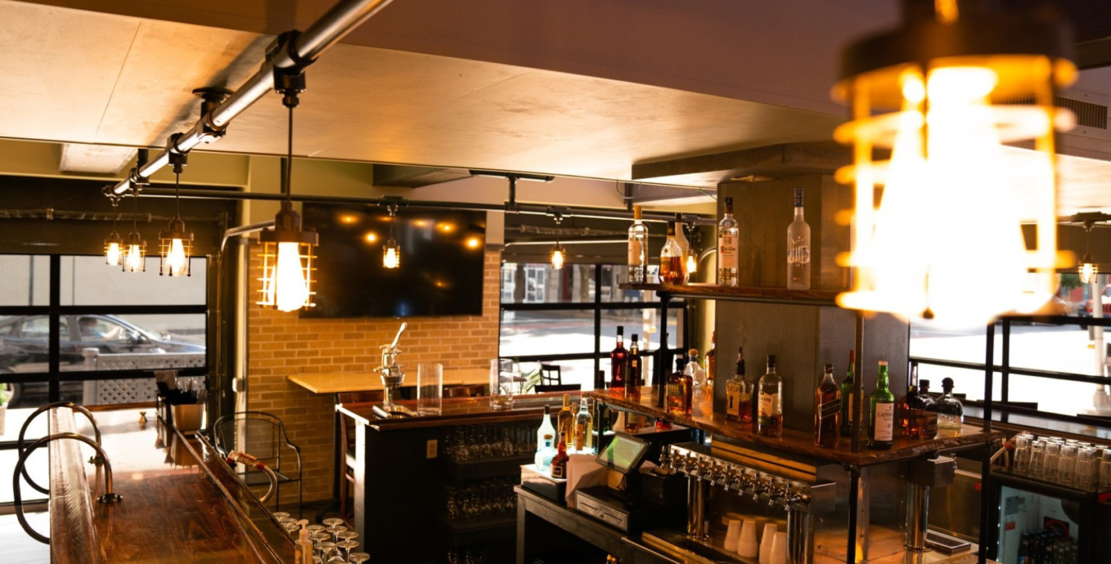 a bar with bottles of alcohol