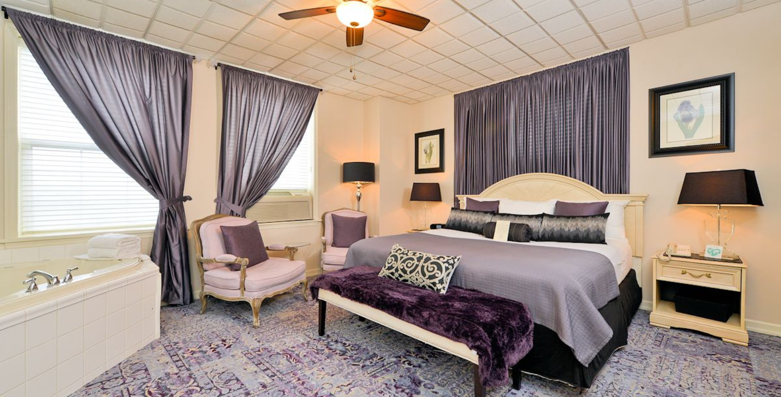 a bedroom with purple curtains and a bed