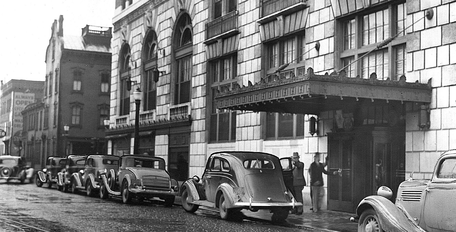a group of cars parked on the street