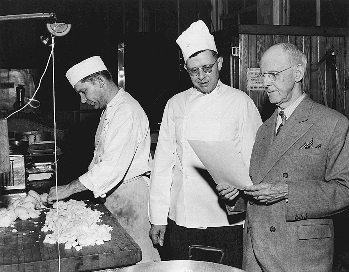 a group of chefs in a kitchen