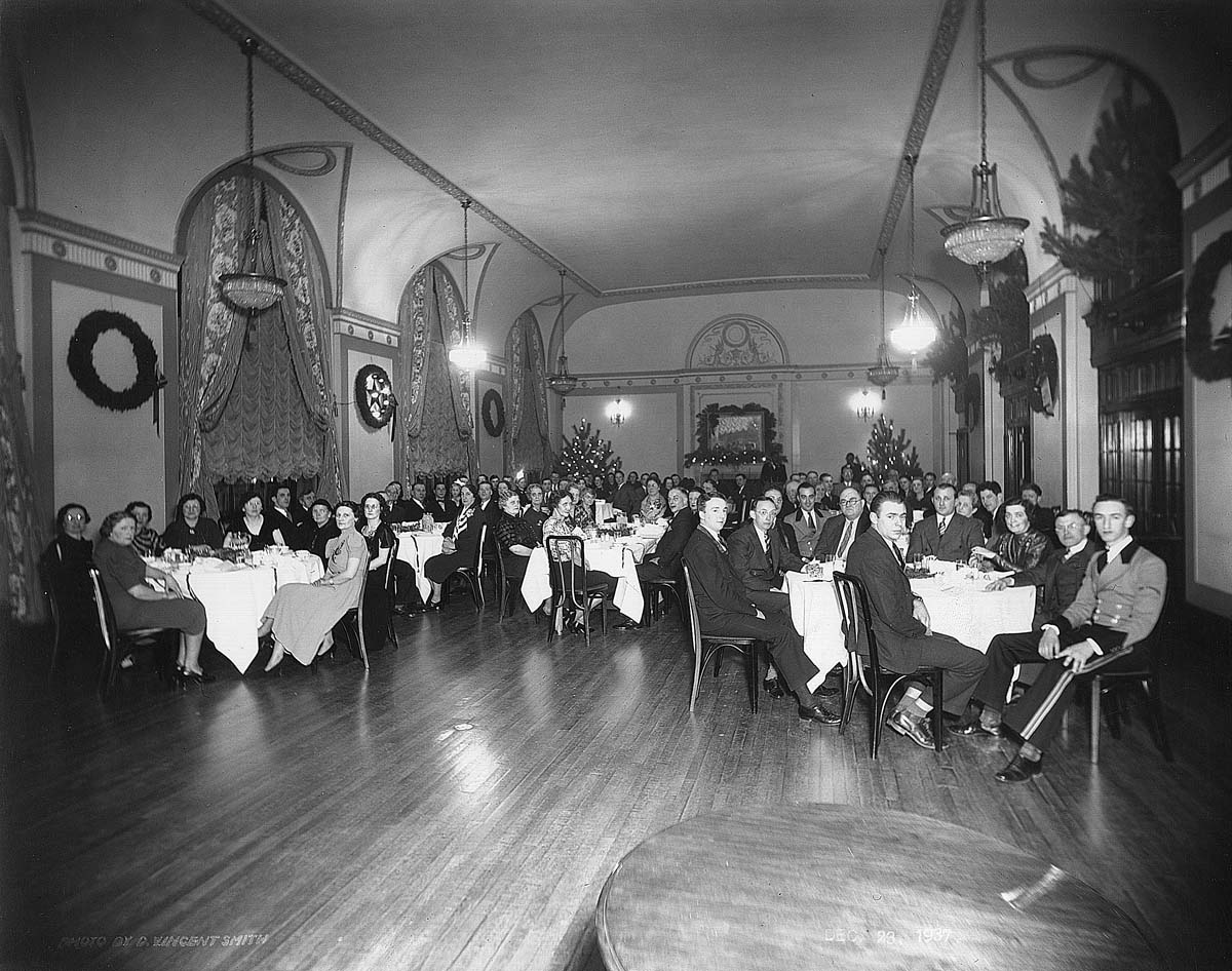 a group of people sitting at tables in a room