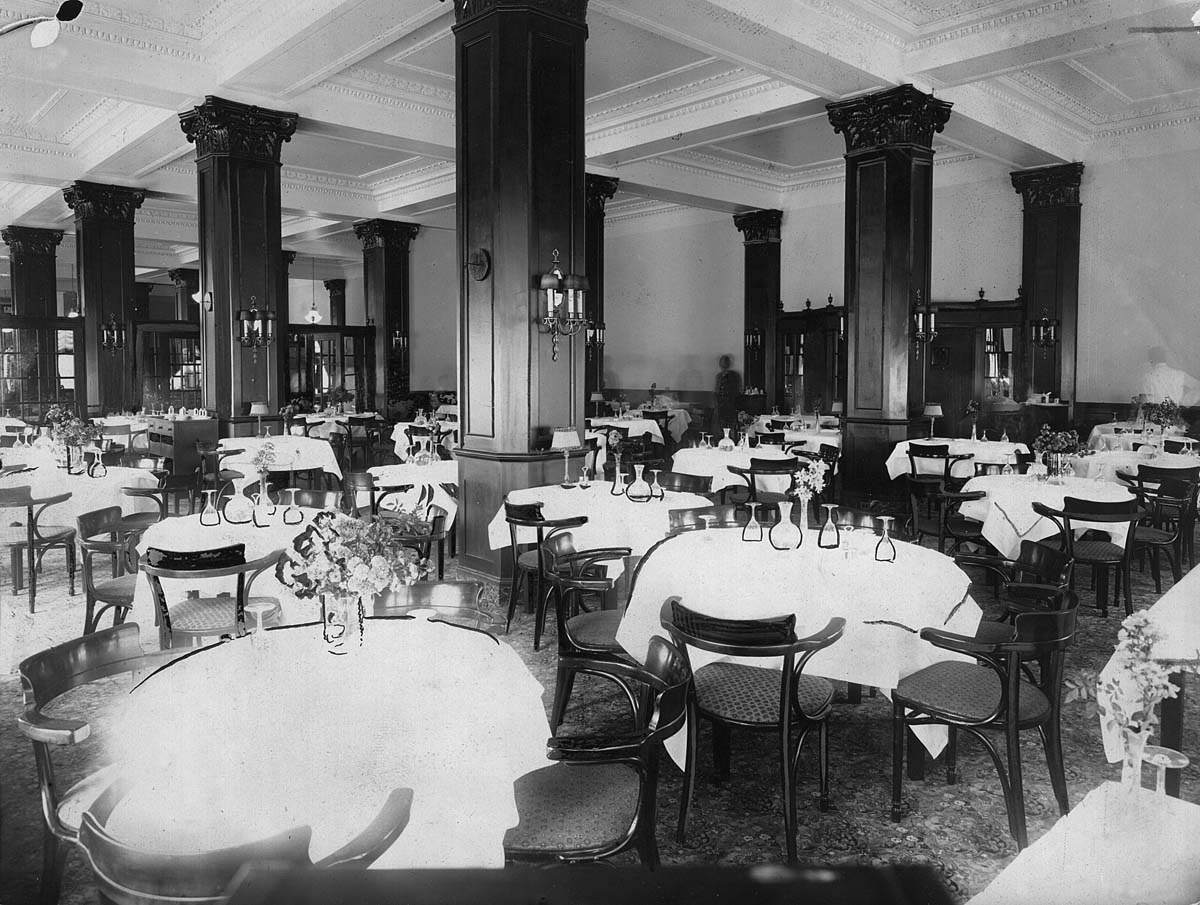 a restaurant with tables and chairs