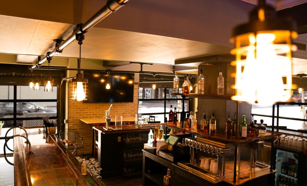 a bar with bottles of alcohol