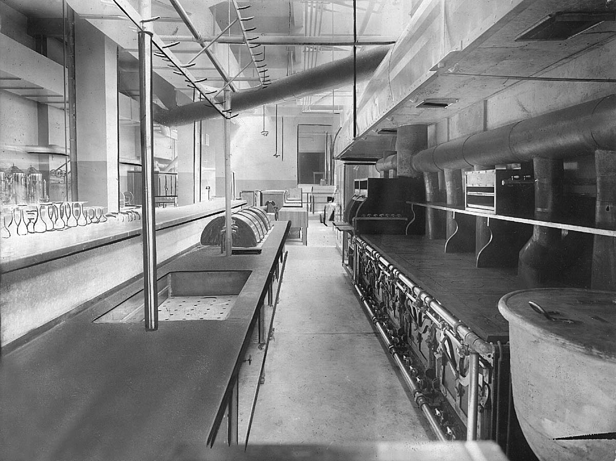 a large industrial kitchen with large pipes
