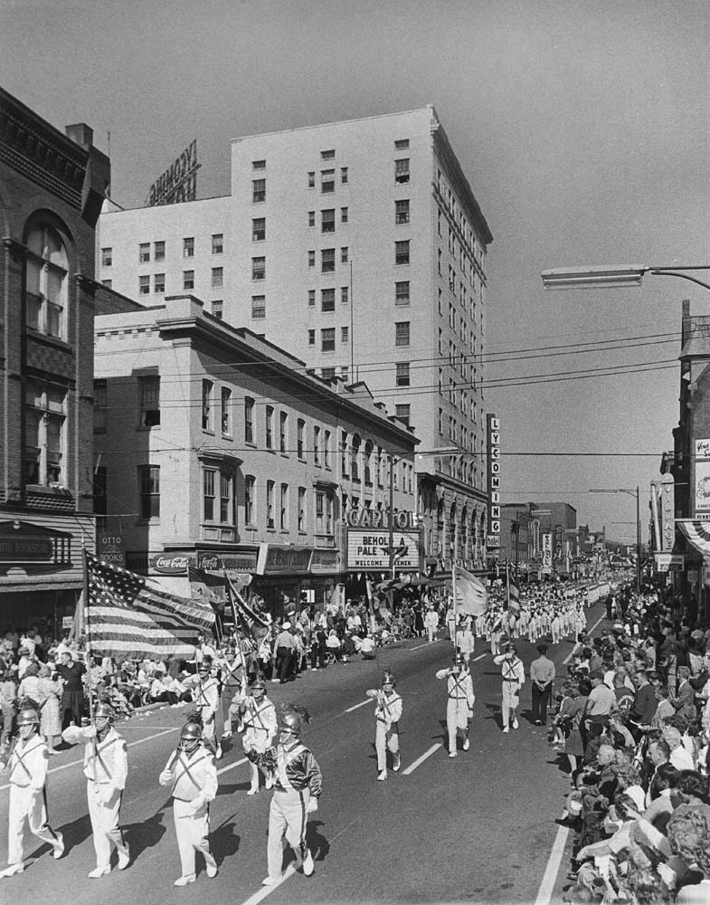 a parade of people in a city