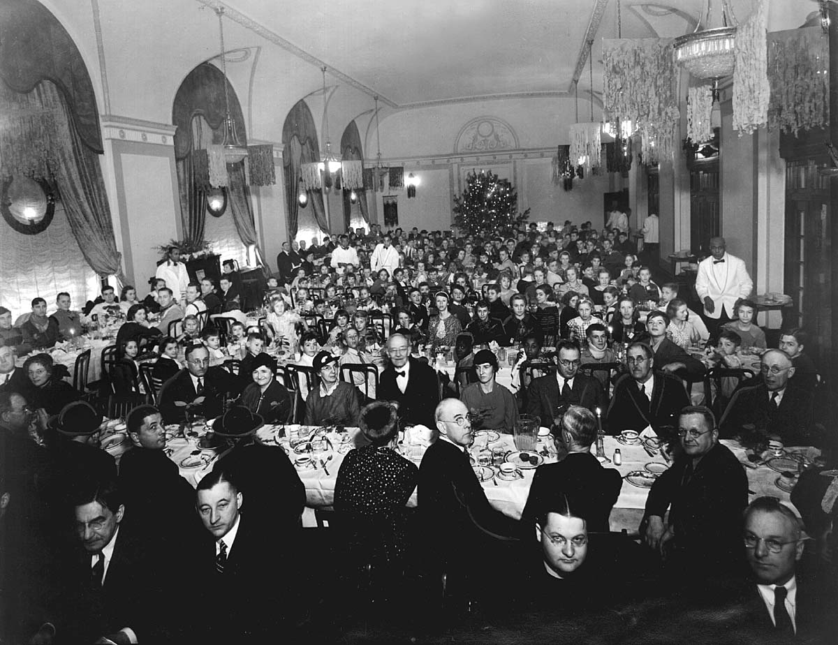 a large group of people sitting at tables