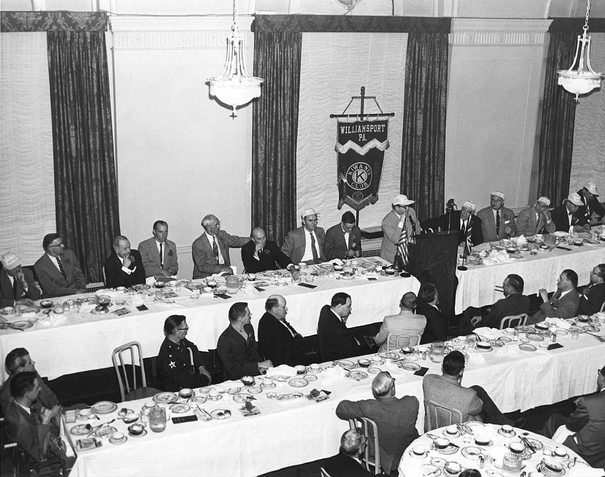 a group of people sitting at a table
