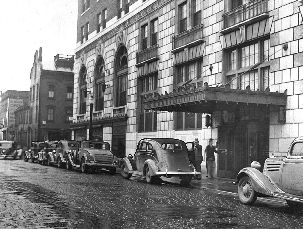a group of cars parked on a street