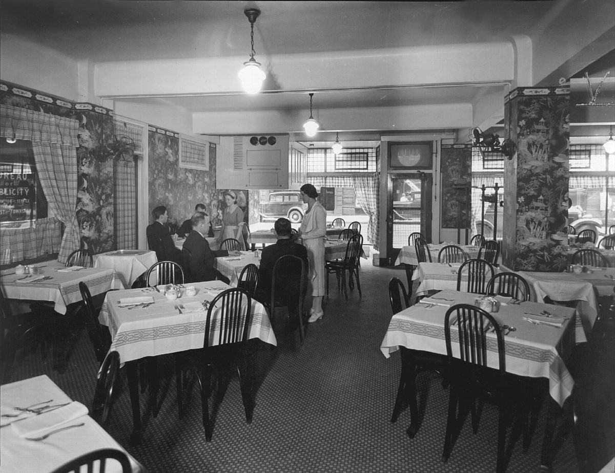 a group of people sitting at tables