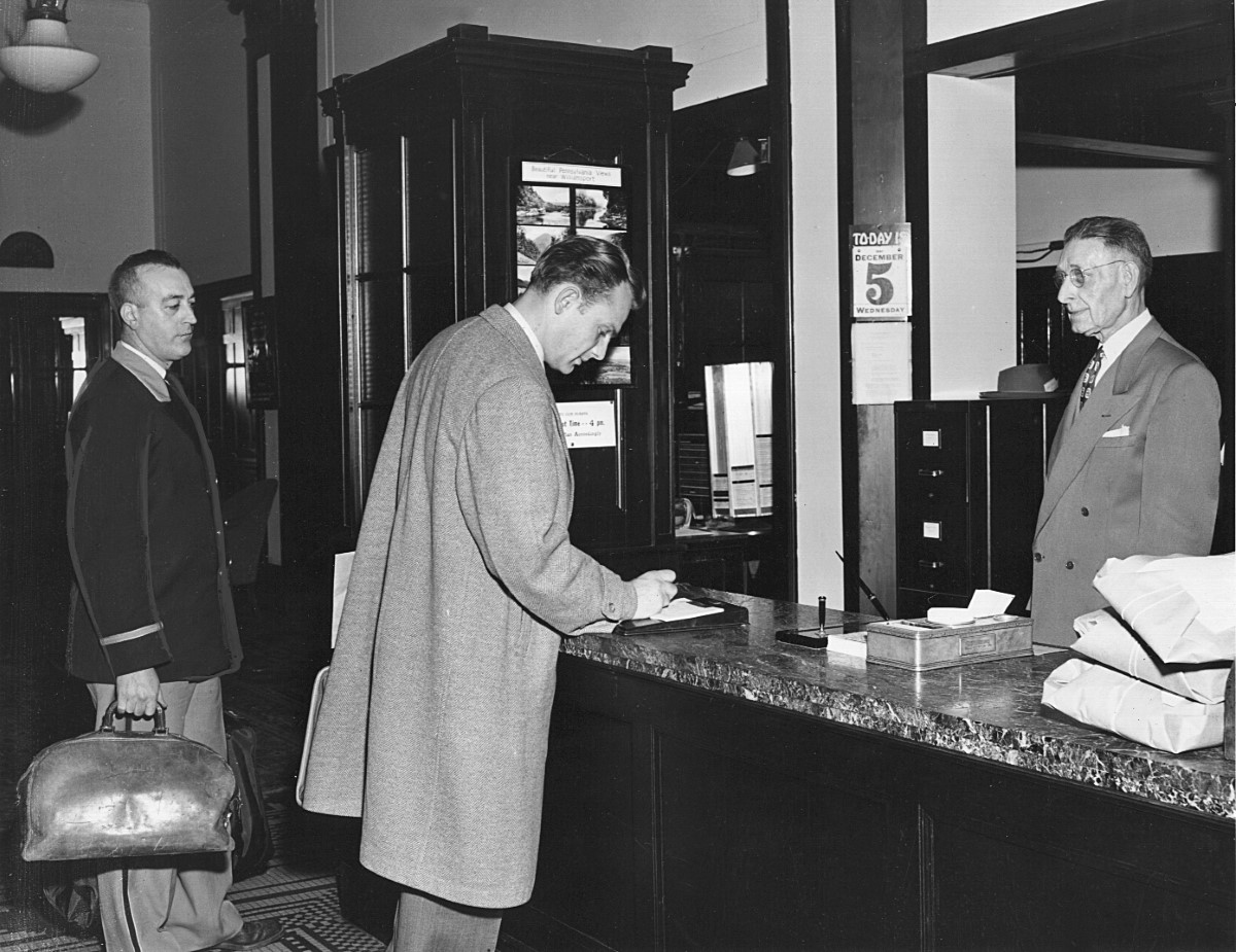 a group of men standing at a counter
