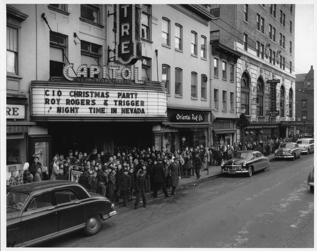 a crowd of people outside a theater