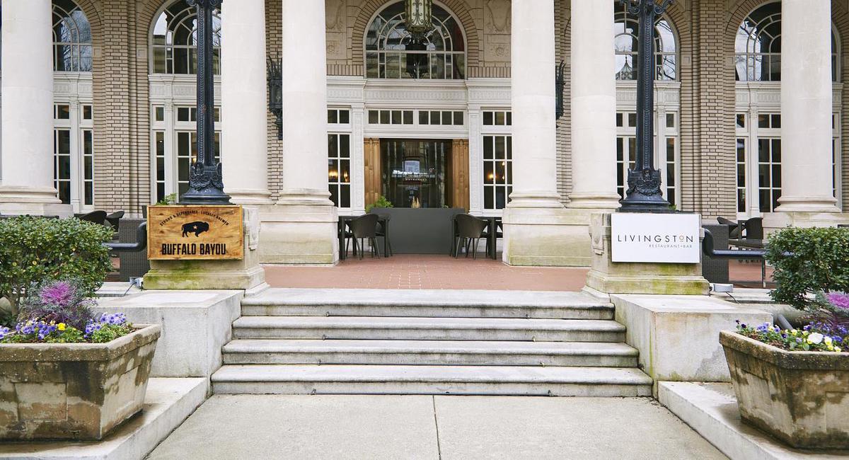 a building with pillars and a sign