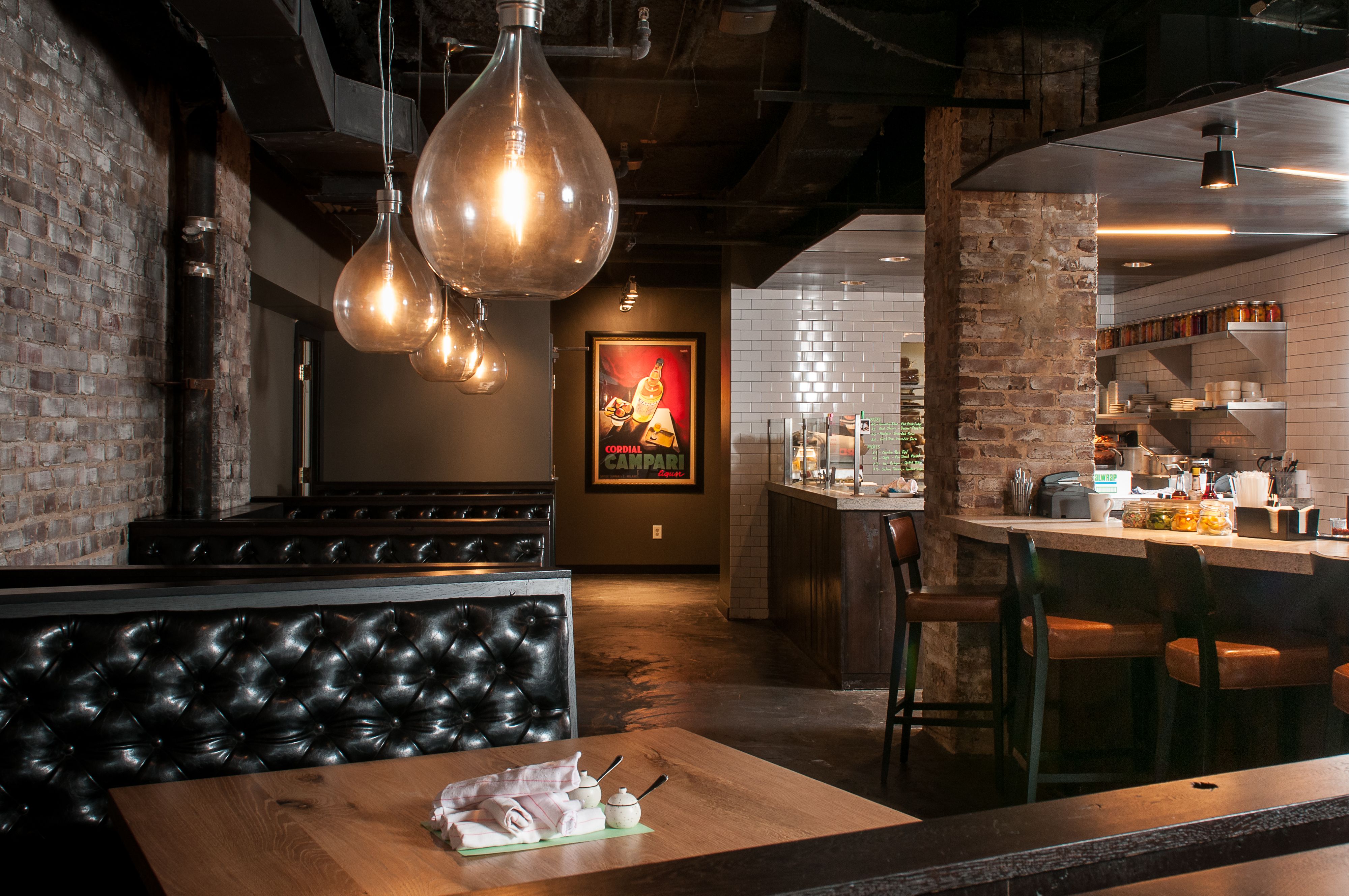 a restaurant with a booth and a table