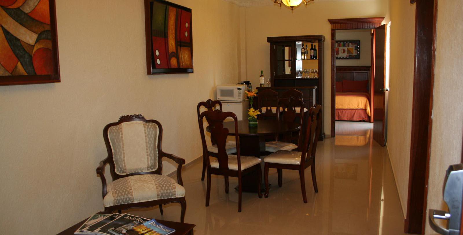 a dining room with a table and chairs