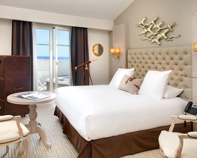 a hotel room with a large bed