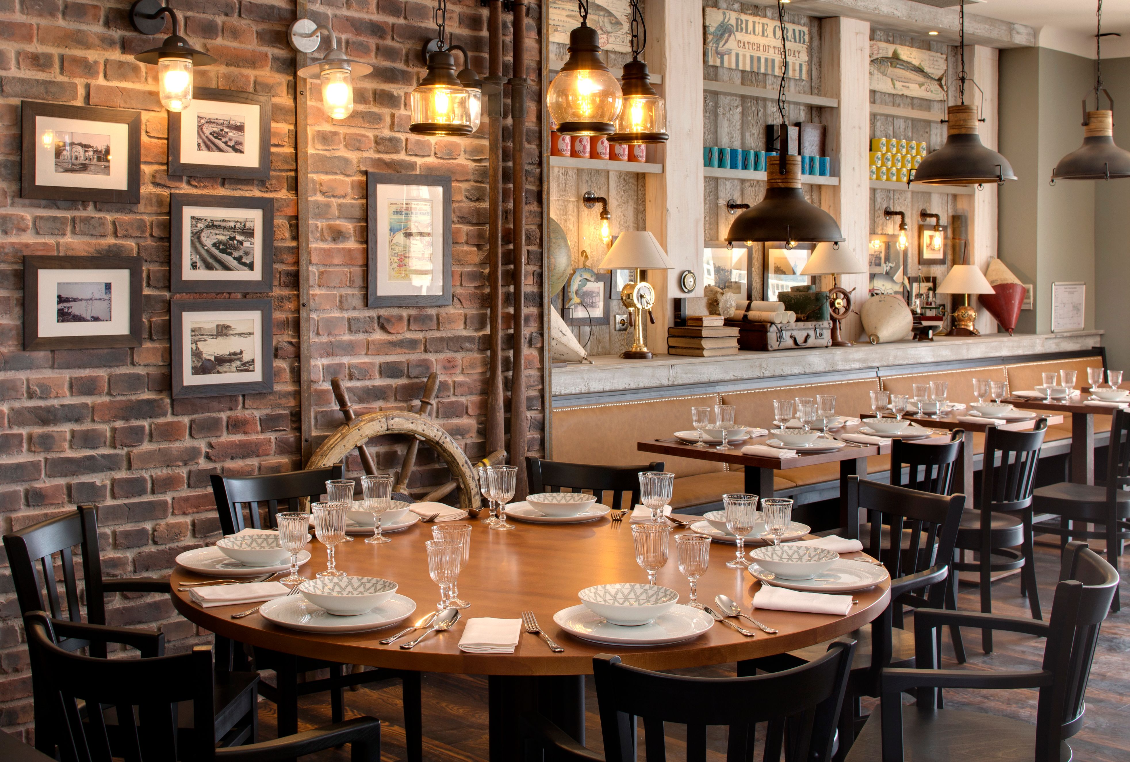 a restaurant with a round table and chairs