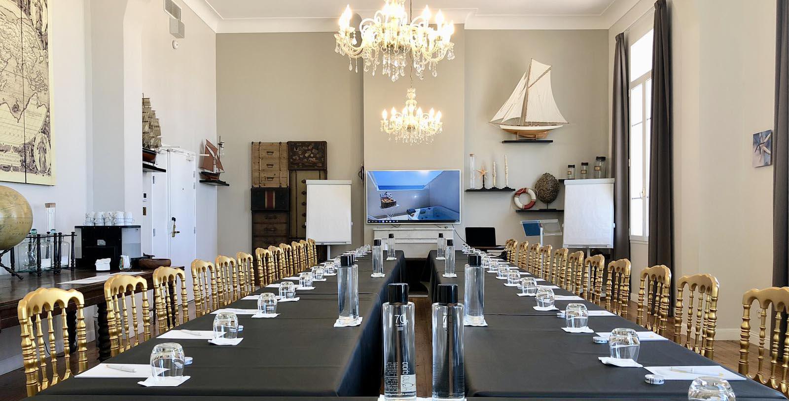 a room with a large table and chairs
