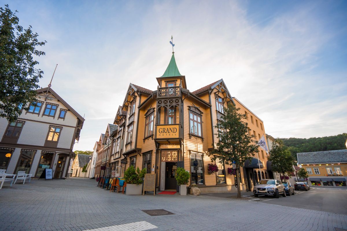 a building with a steeple and a green roof