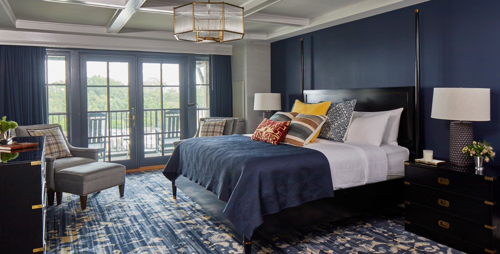 a bedroom with a bed and a glass door