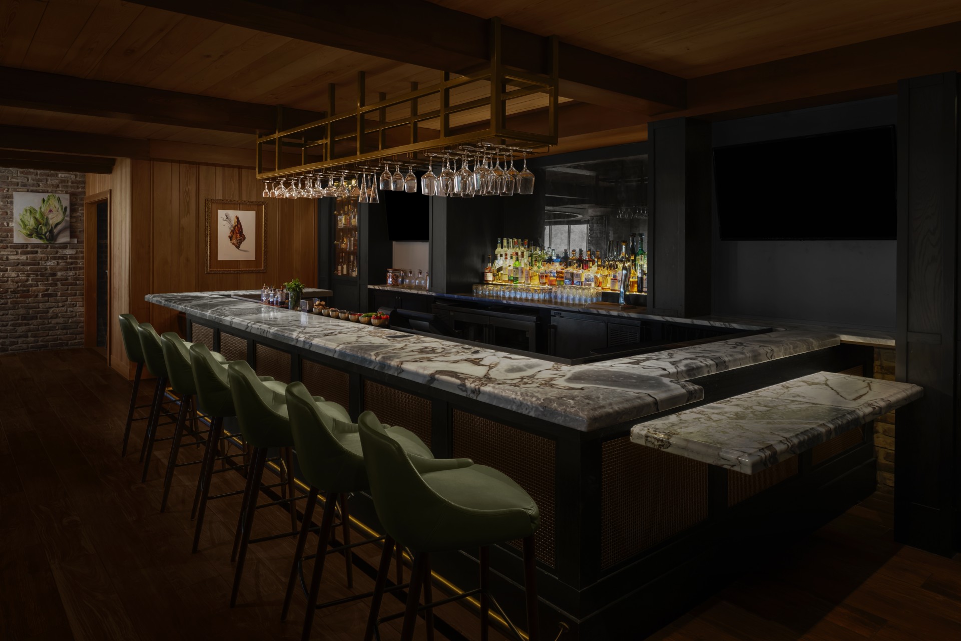 a bar with a counter and chairs