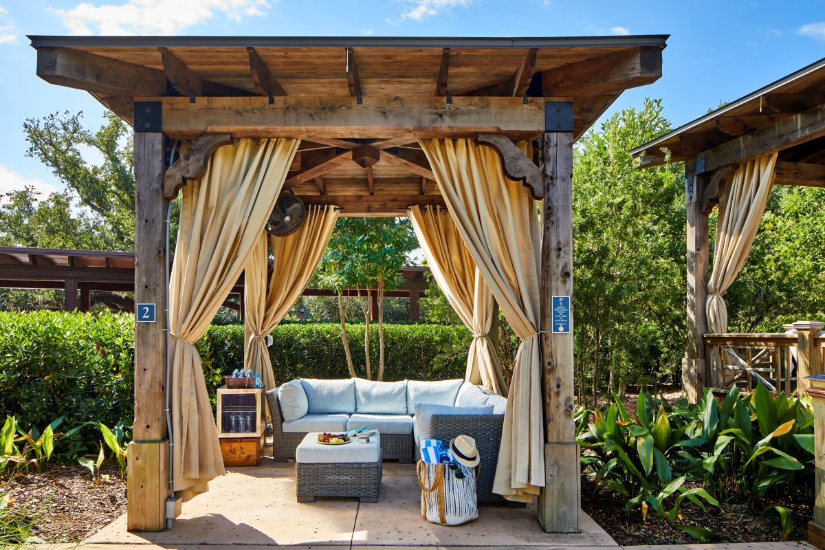 a wooden structure with a couch and chairs