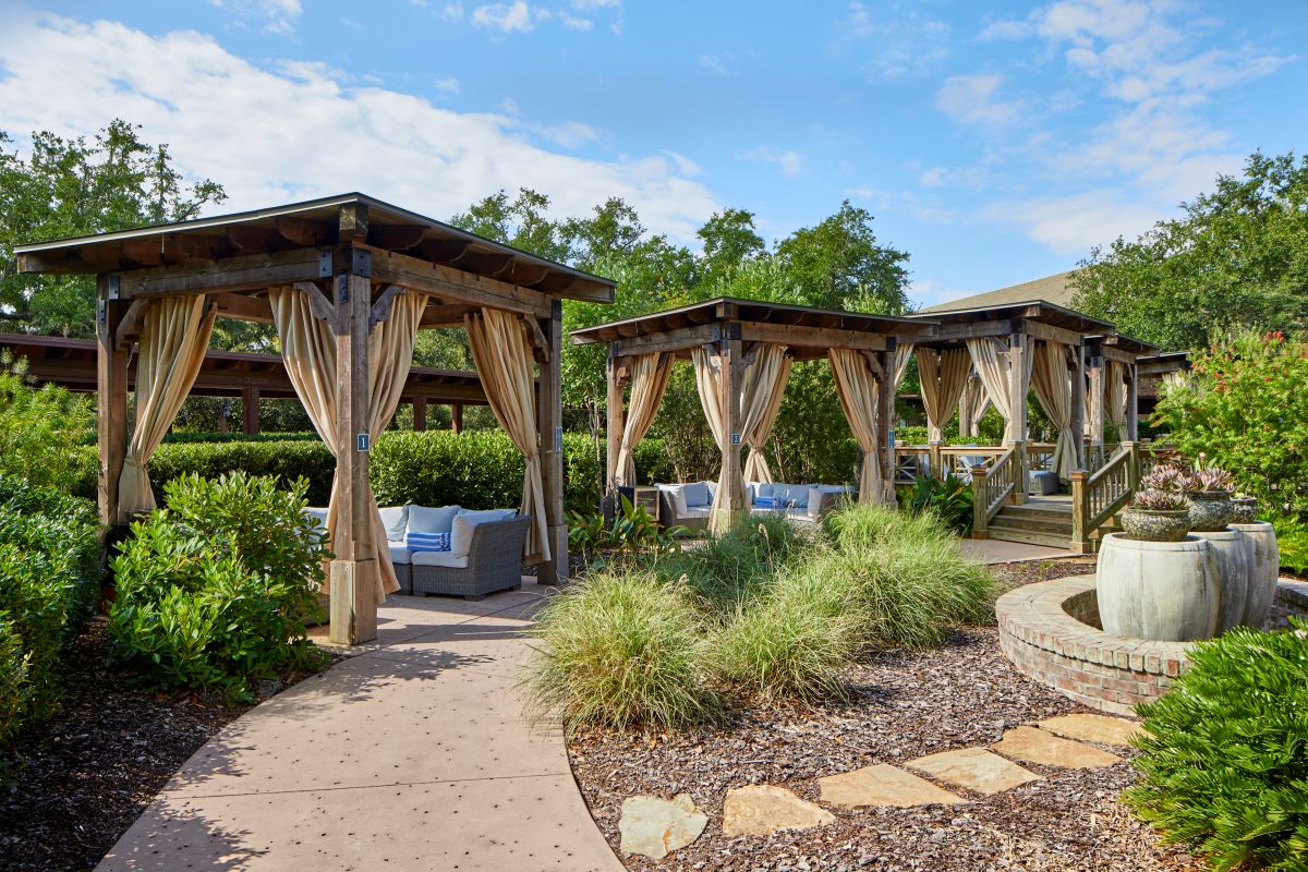 a patio area with a stone path and a stone walkway