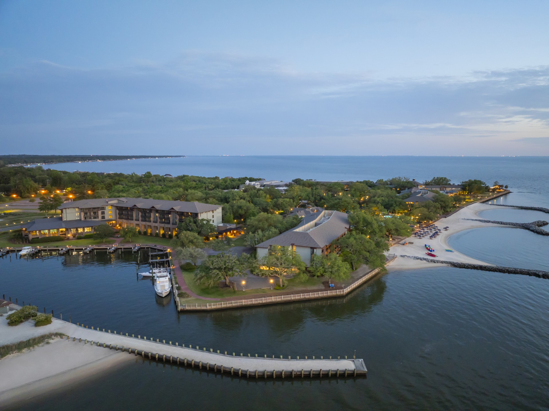 a body of water with buildings and a dock