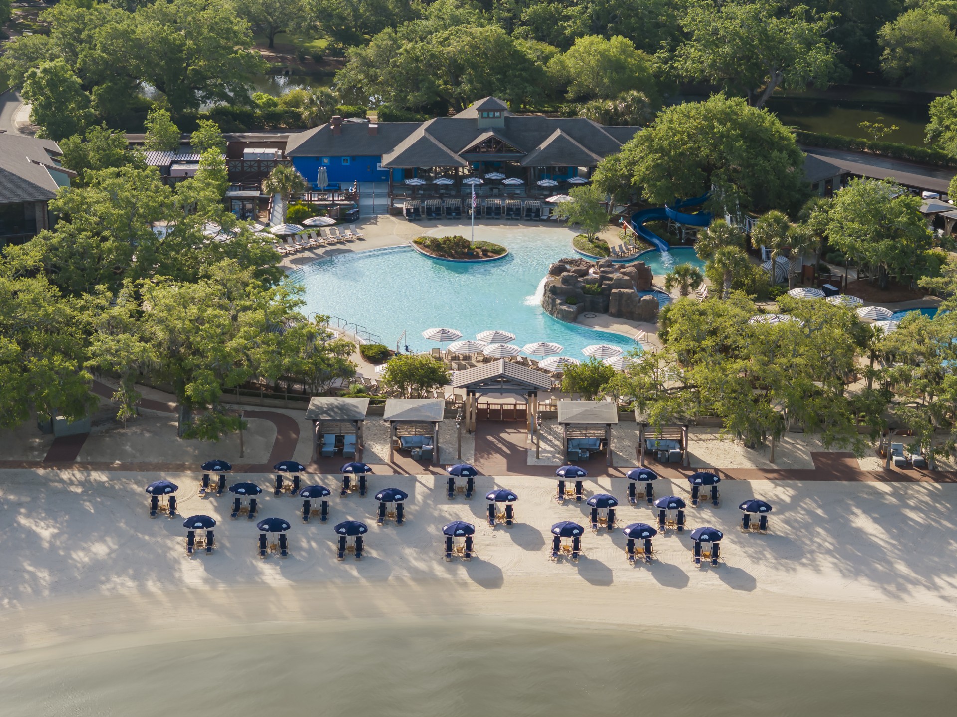 a swimming pool and a resort with trees
