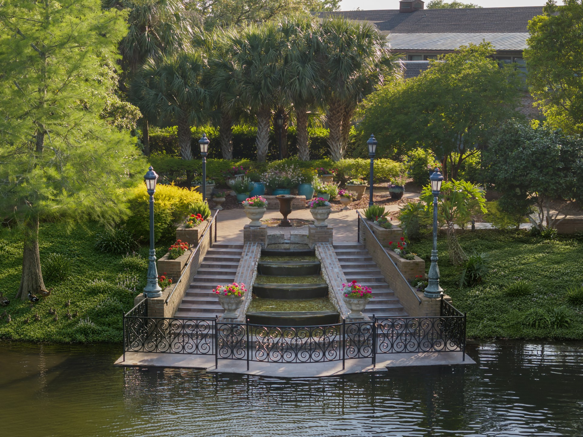 a pond with a fountain and a fountain in it