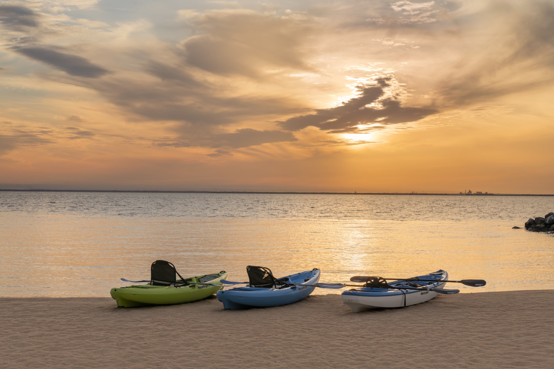 a group of kayaks on a beach