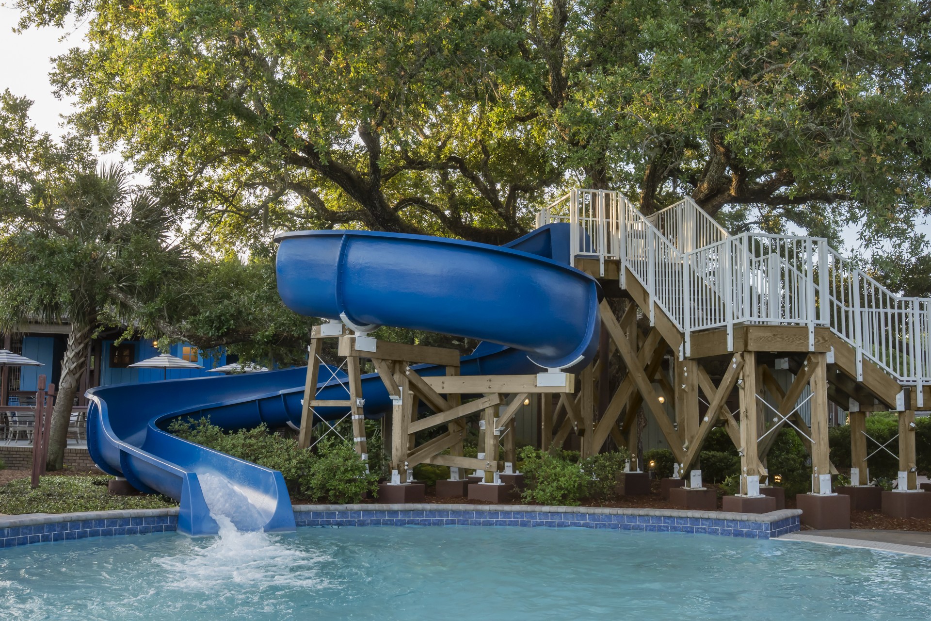 a water slide next to a pool