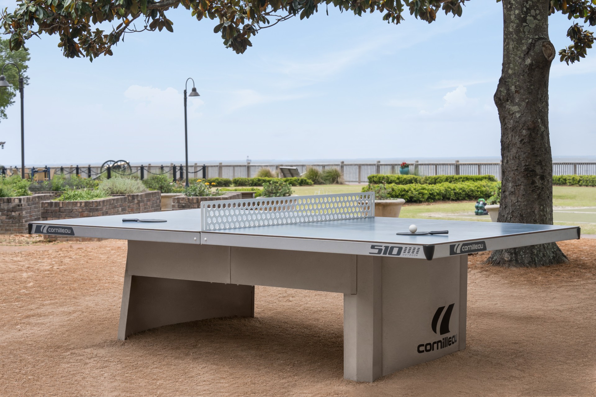 a ping pong table on a beach