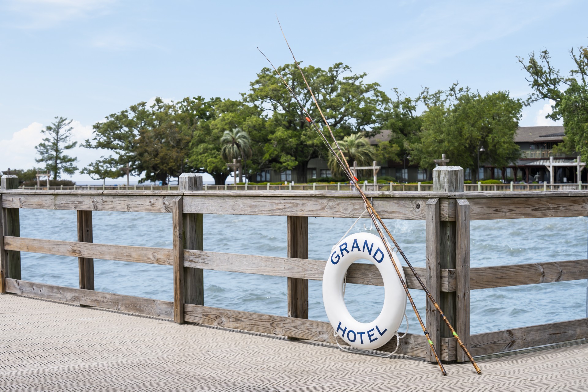 a fishing pole and life preserver on a dock