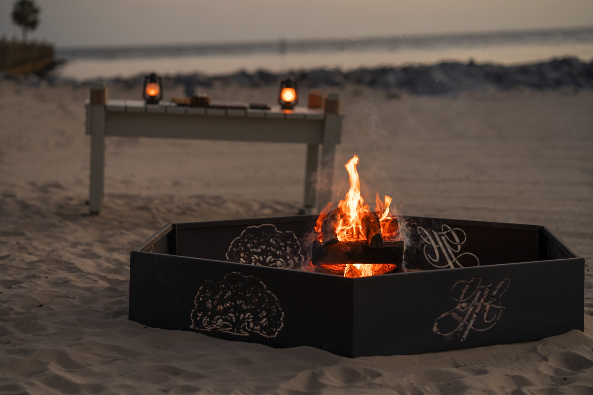 a fire pit on a beach