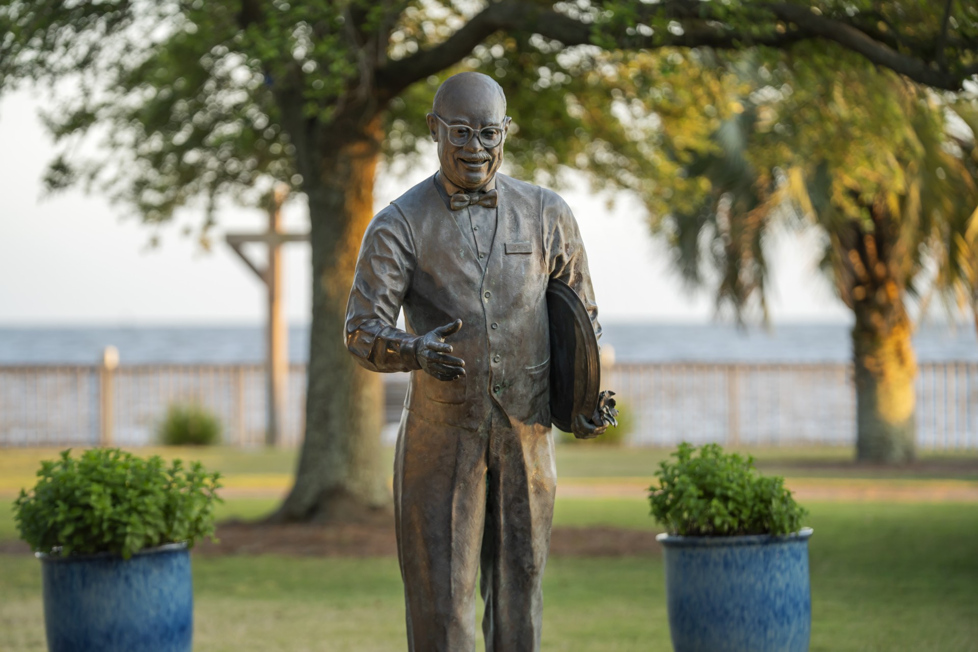 a statue of a man in a suit and glasses