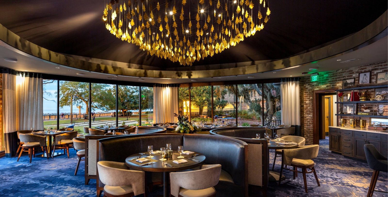 a chandelier over a round table