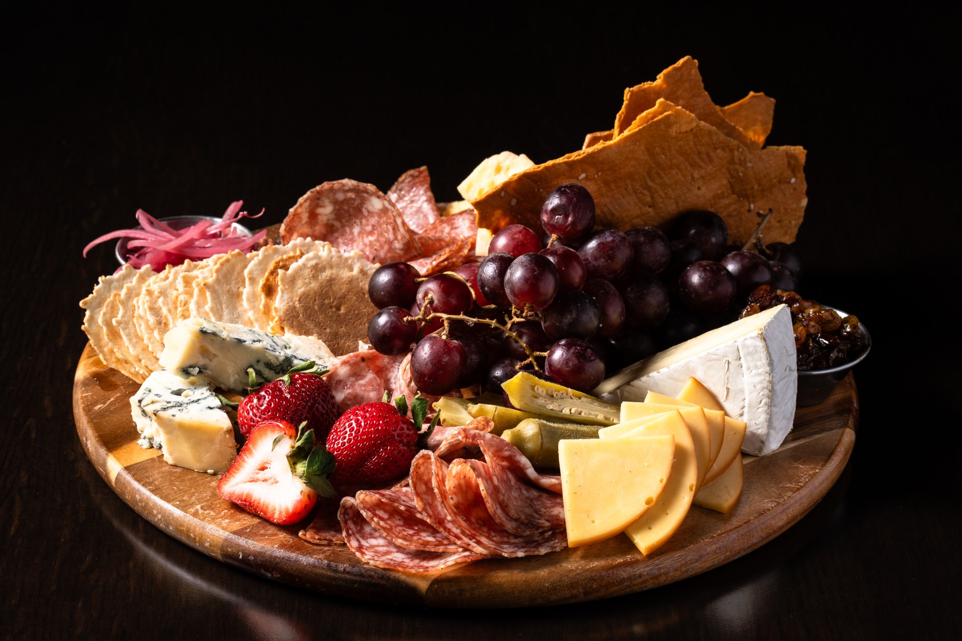 a platter of food on a wooden surface