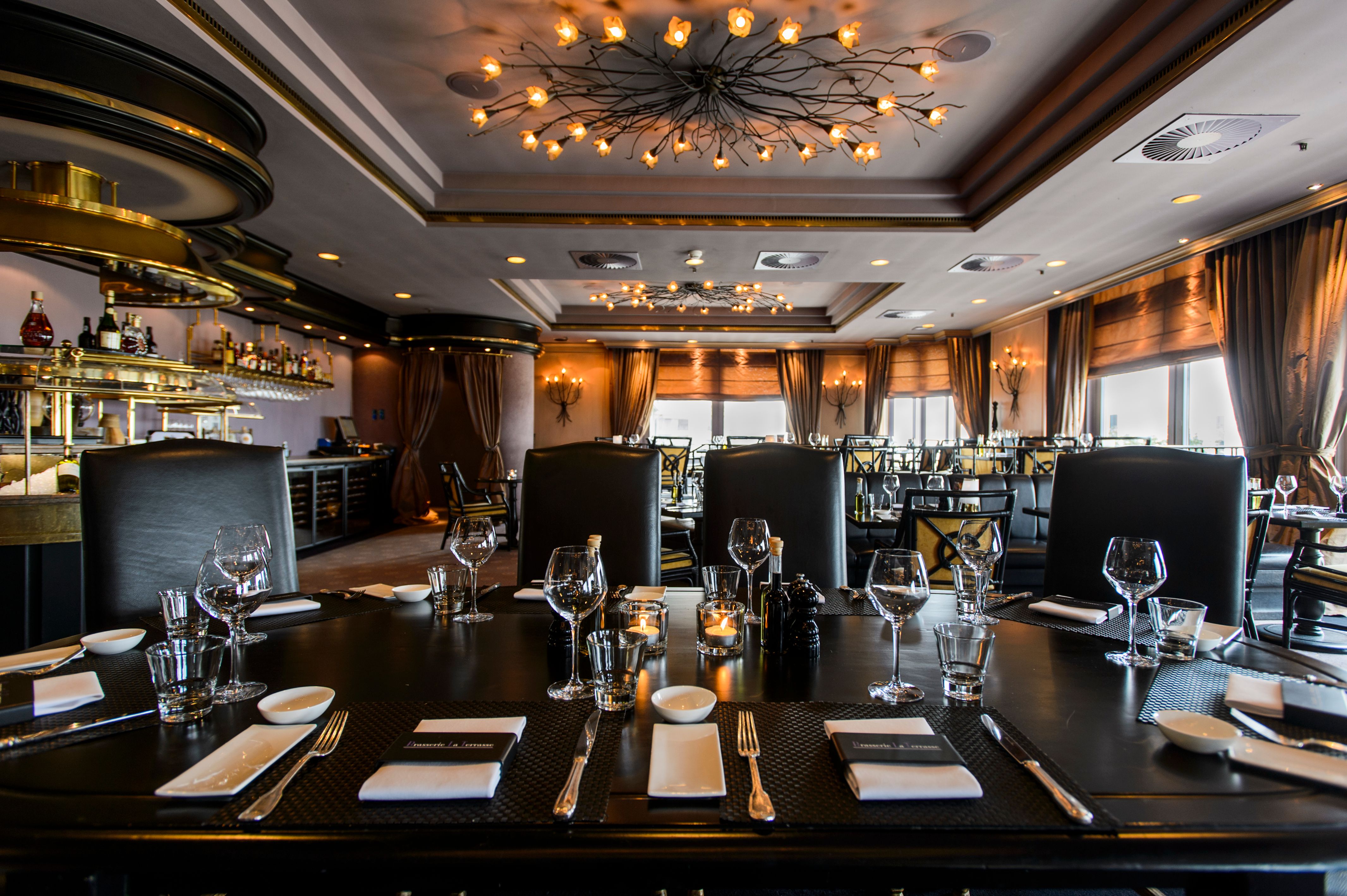 a restaurant with a chandelier and a chandelier