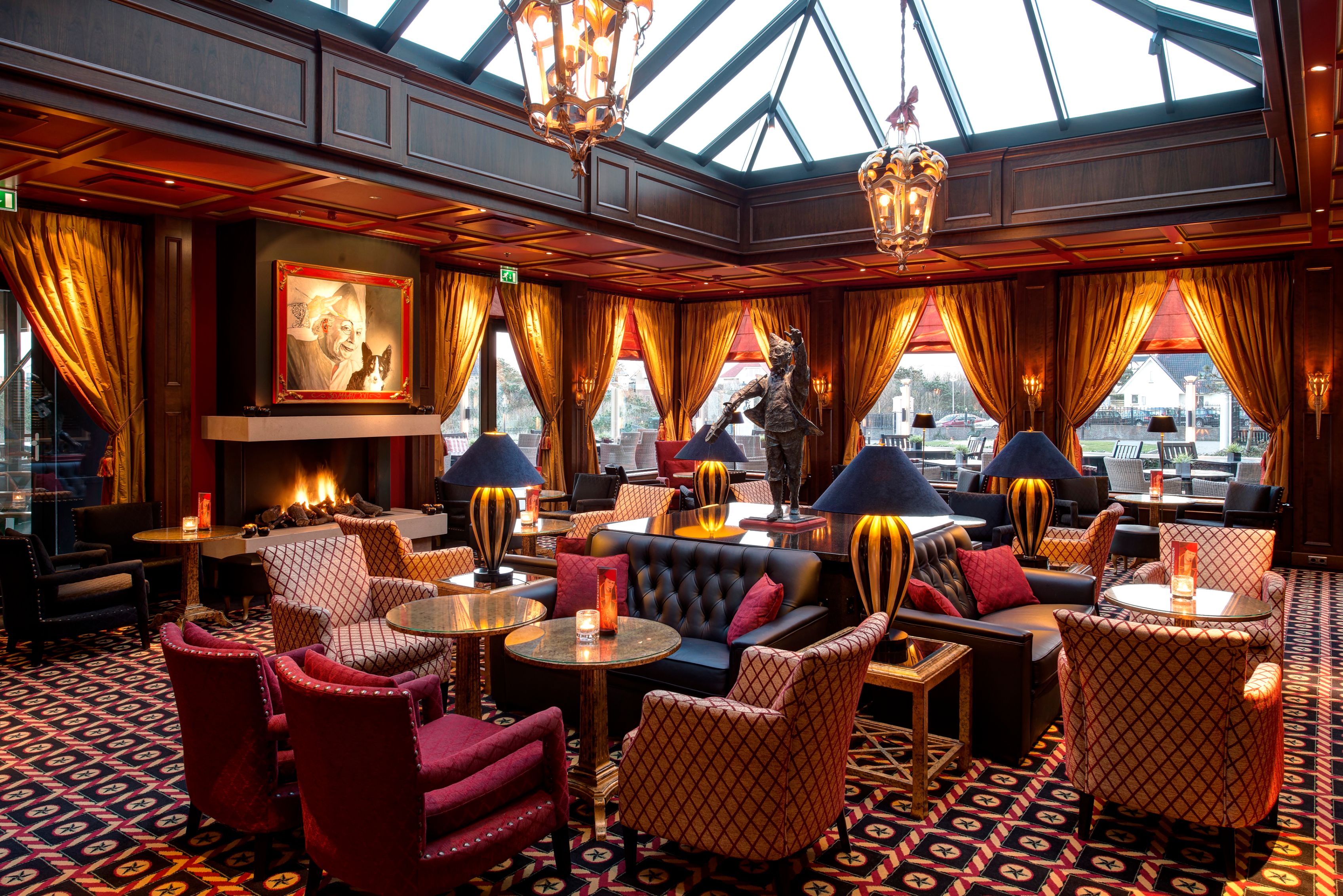 a room with a fireplace and tables and chairs