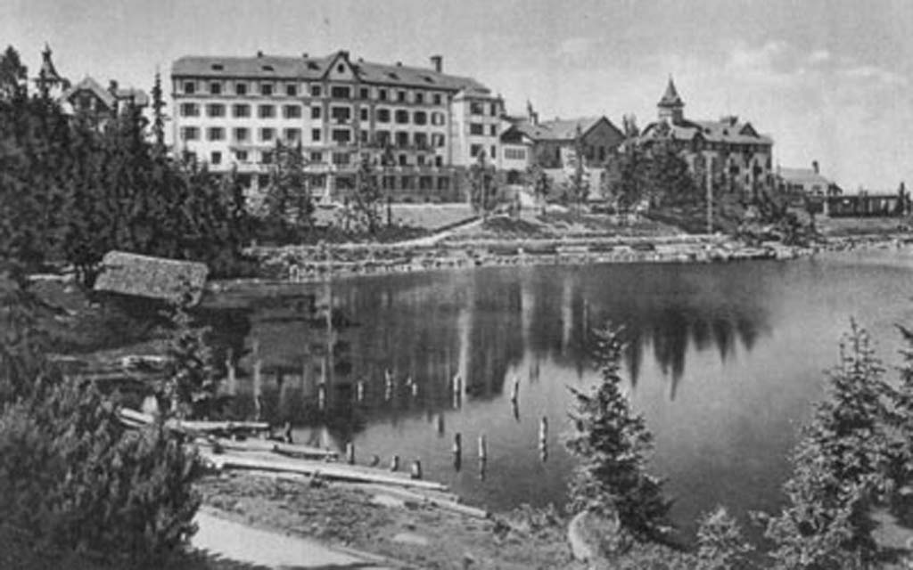 a large building next to a lake