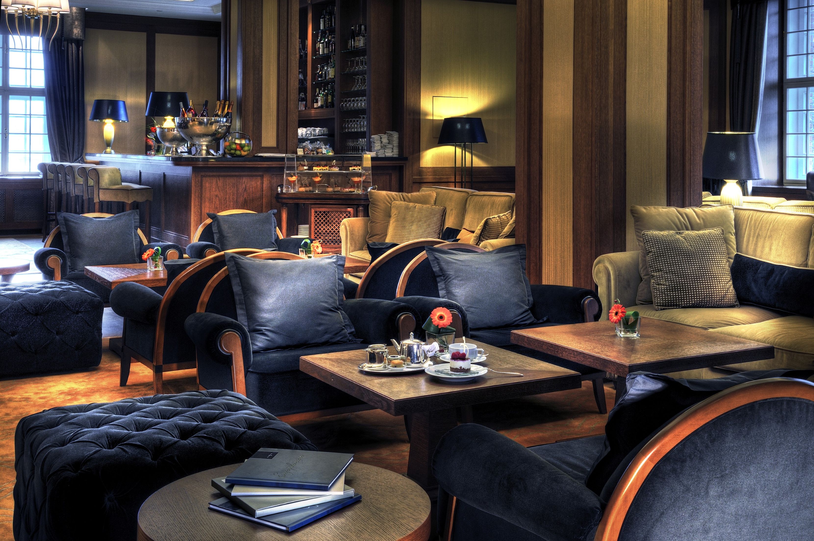 a room with a couch and chairs