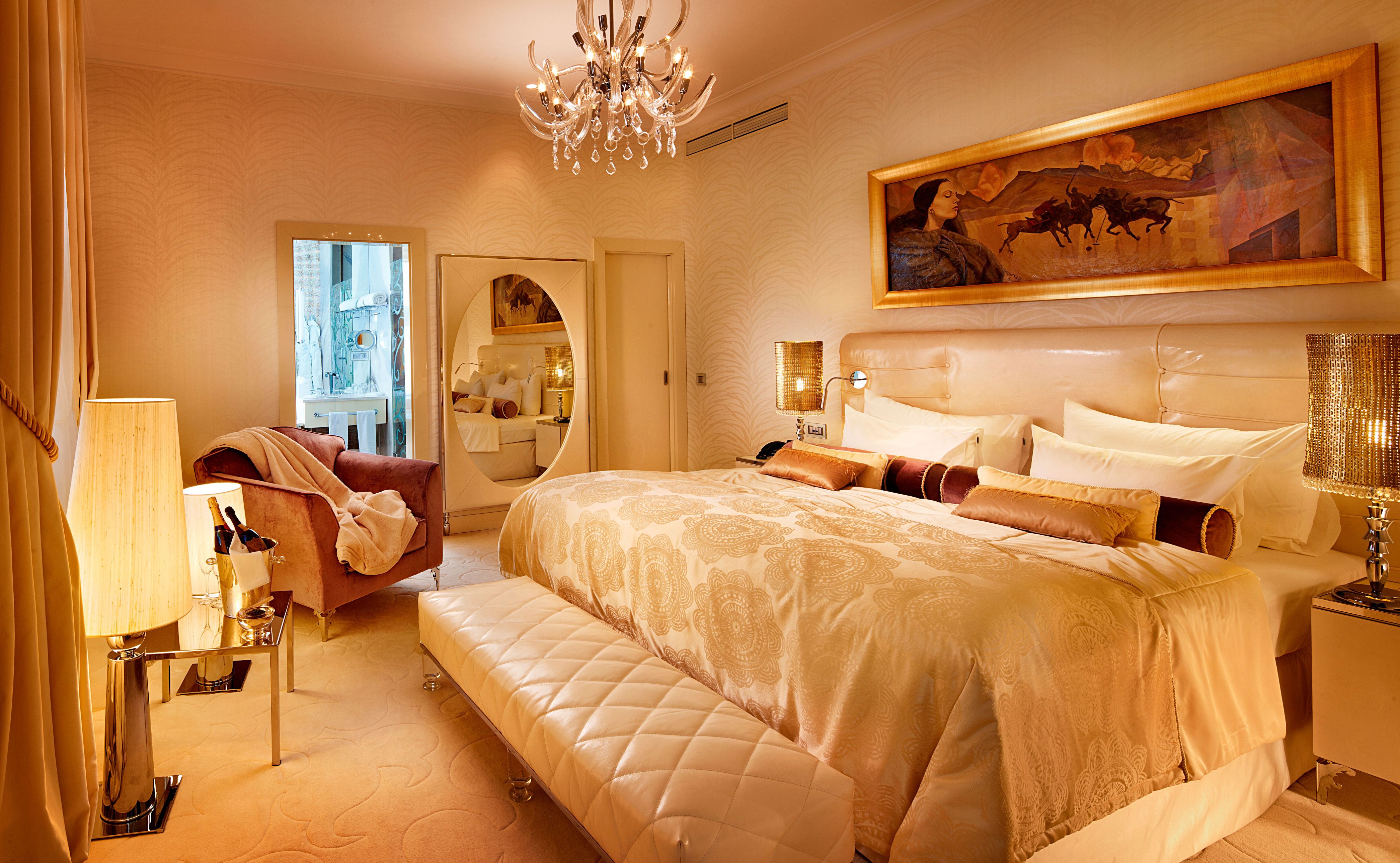 a bedroom with a bed and a mirror