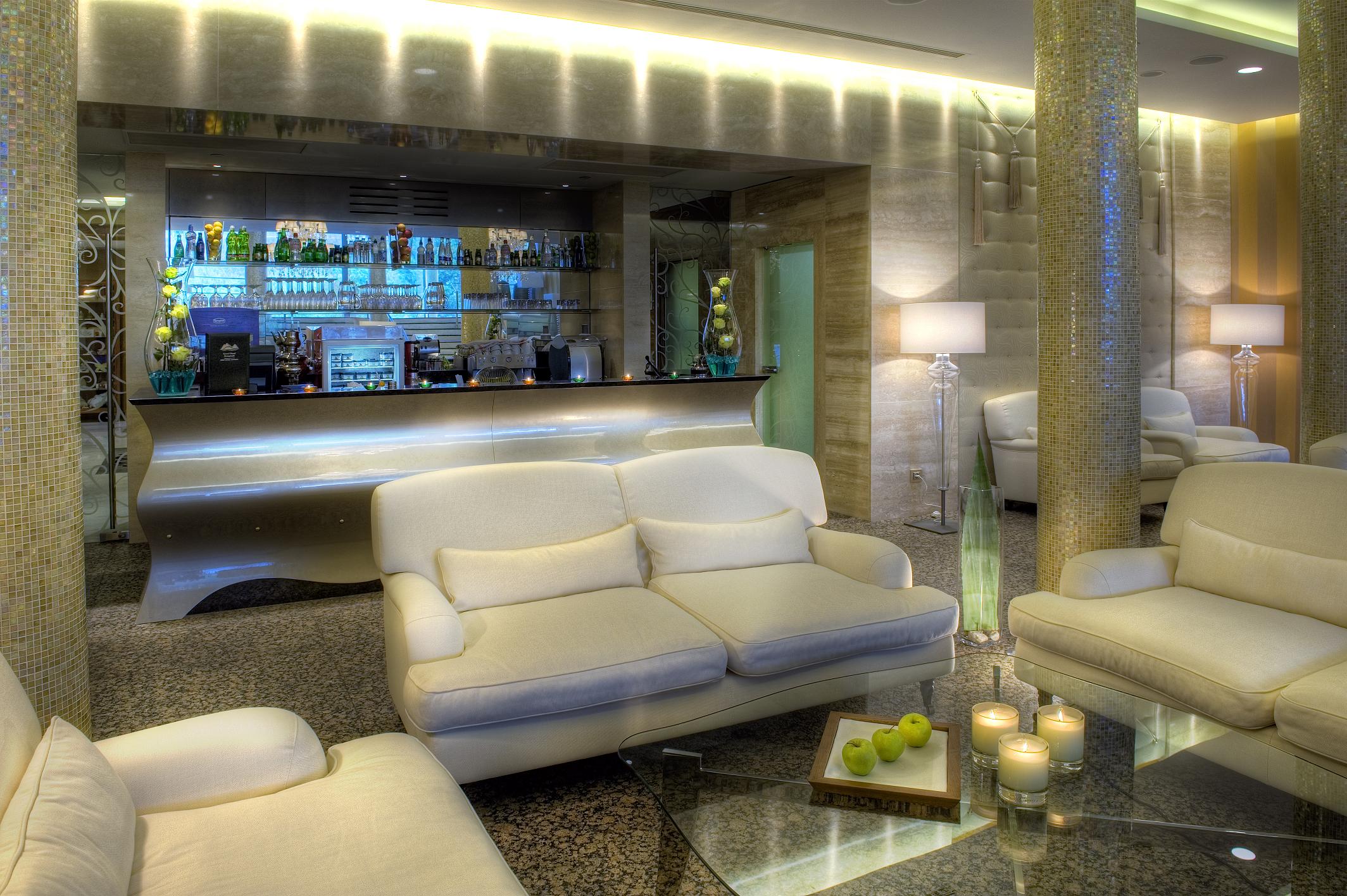 a room with a bar and a white couch
