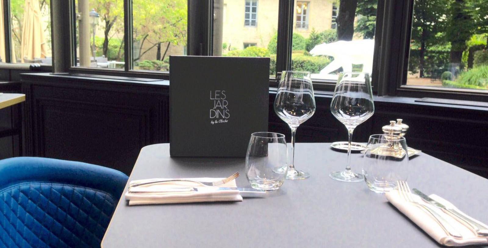 a table with glasses and a menu