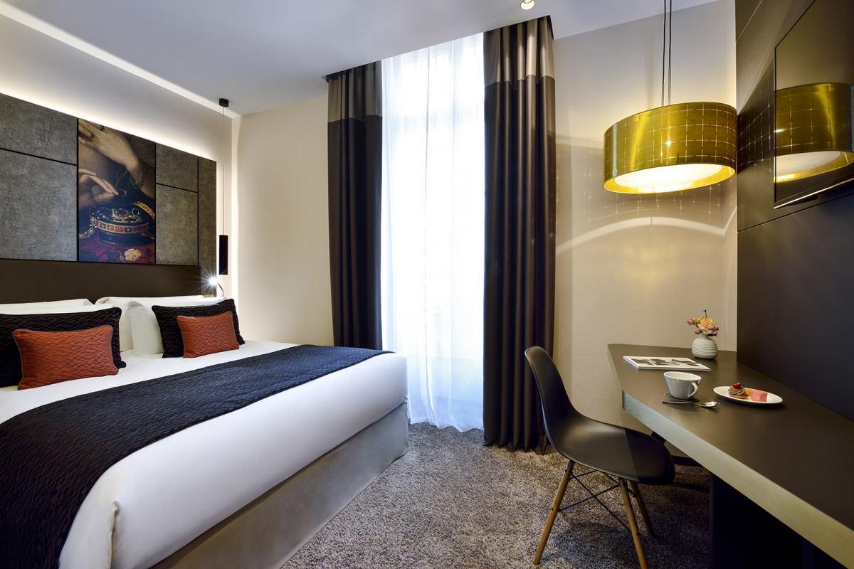 a room with a bed and a desk
