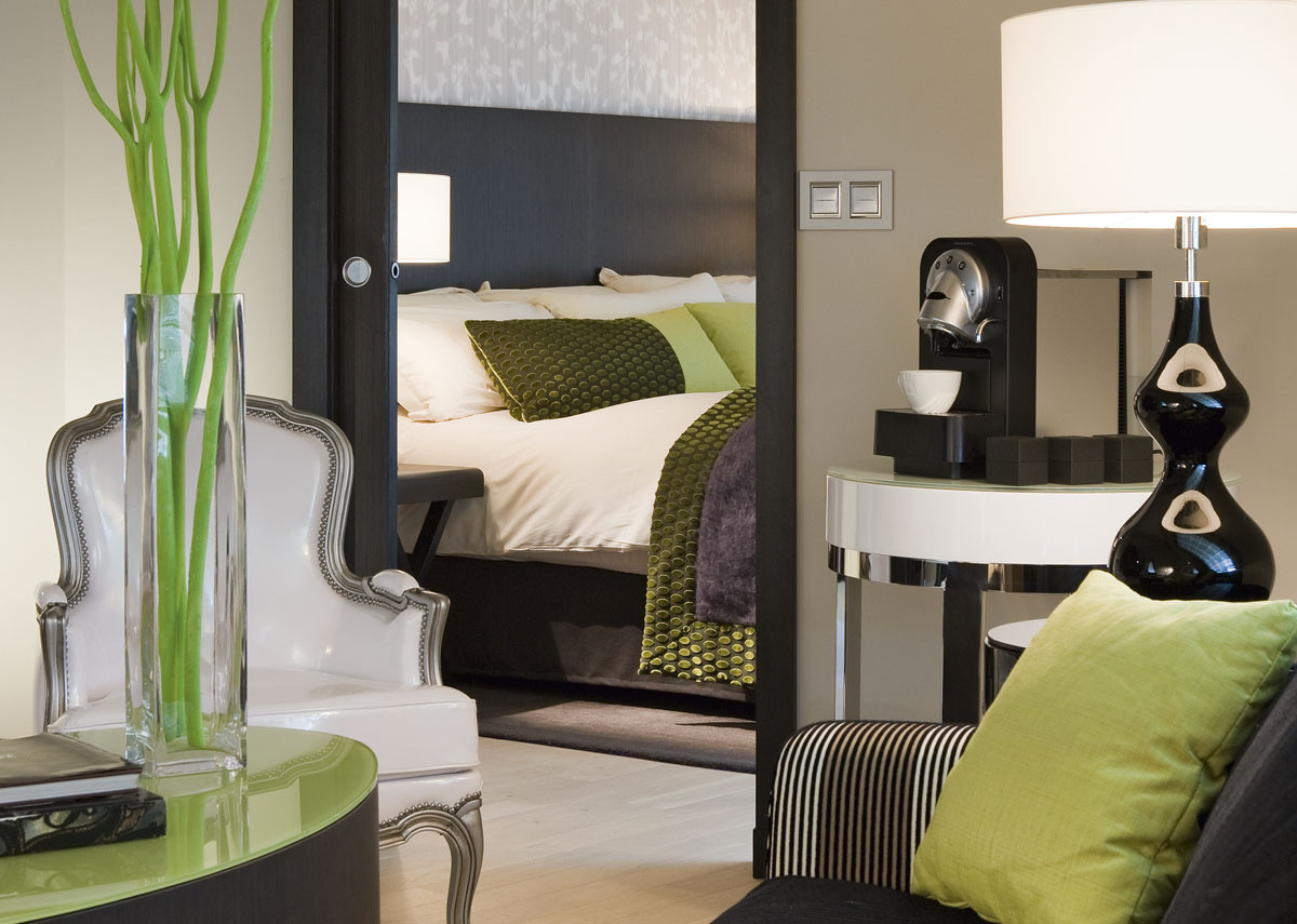 a bedroom with a bed and a table