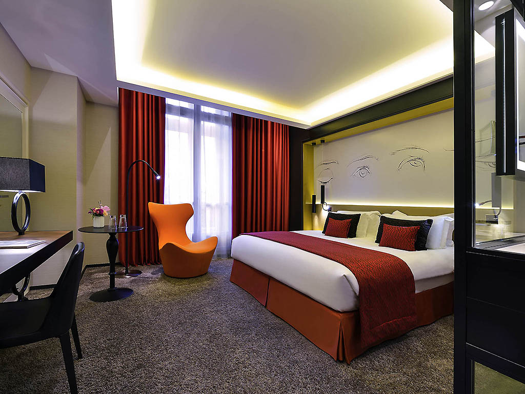 a room with a bed and a chair