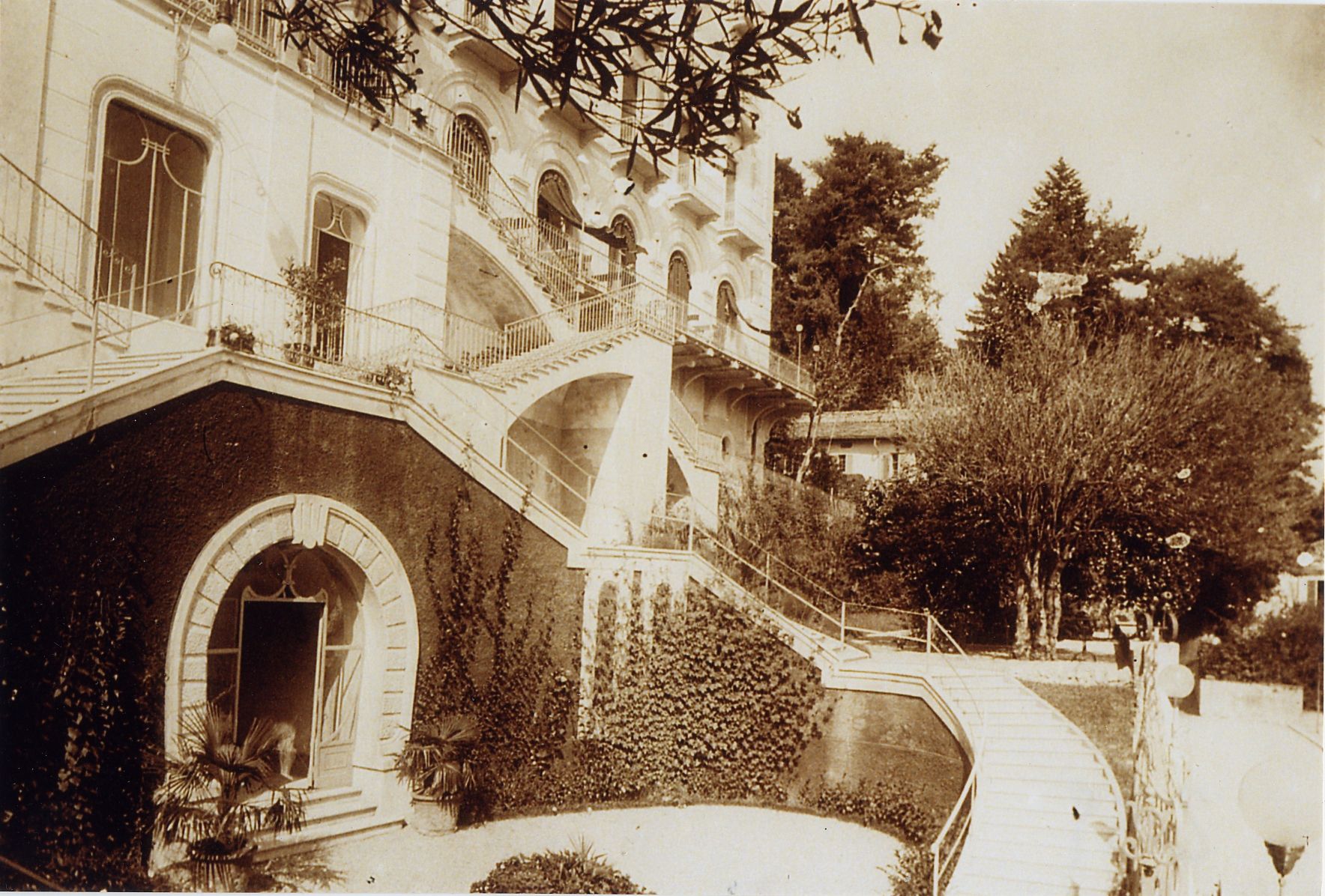 a building with stairs and a pond