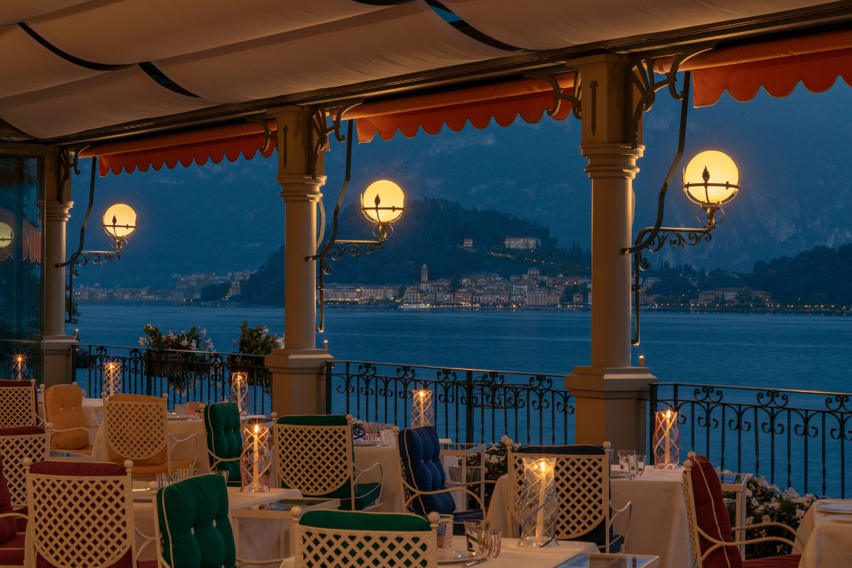 a restaurant with tables and chairs and a view of the water