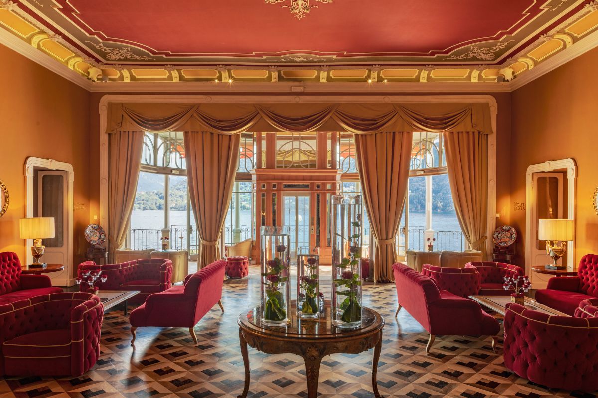 a room with red furniture and a large window